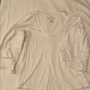 White top with elegant flowy eyelet sleeves